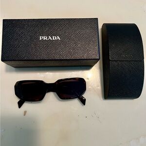 Prada tortoiseshell sunglasses.